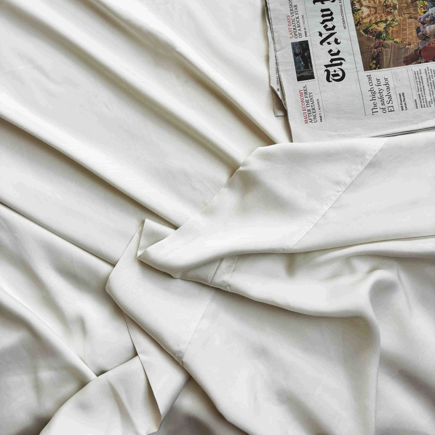 Flat beige bamboo sheet on bed – soft, breathable and sustainable bedding