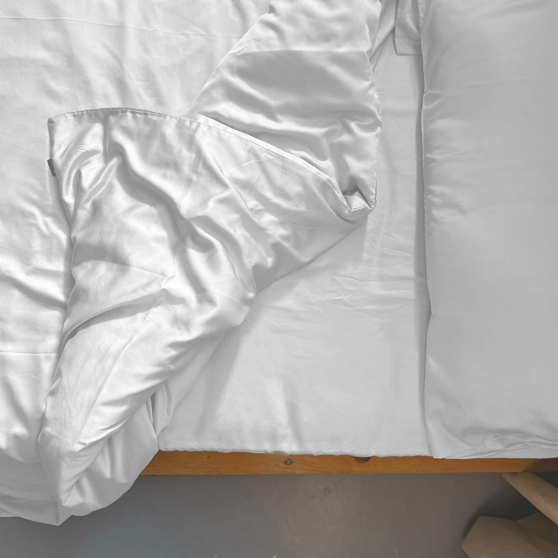 Top view of white bamboo duvet set with pillows – soft, breathable and sustainable bedding