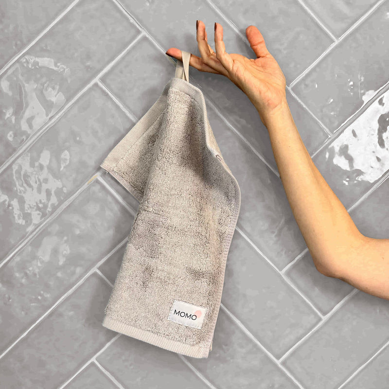 With a loop for hanging, folding, or simply leaving it out.